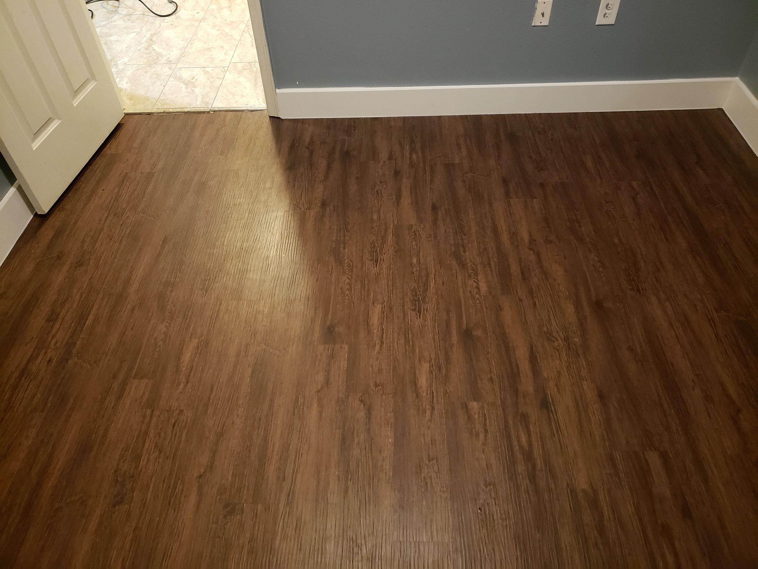 Carpet removal and plank installation.